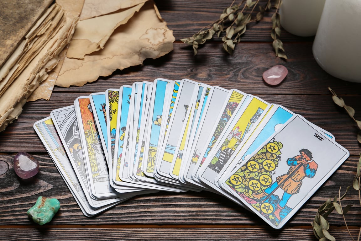 Tarot Cards and Crystals on Wooden Table